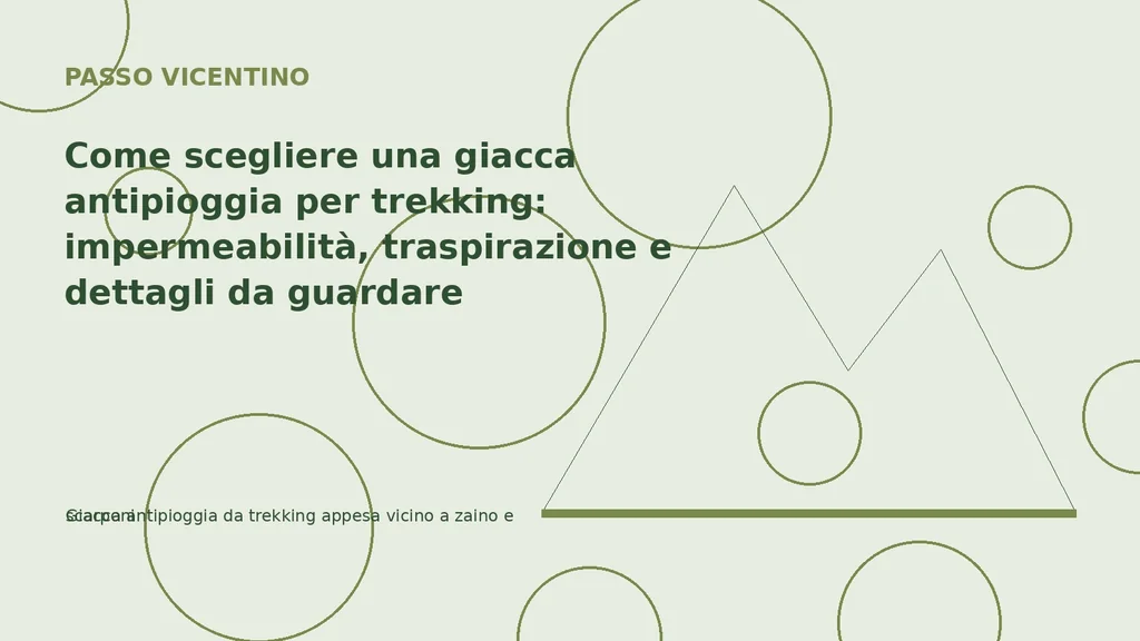 Giacca antipioggia da trekking appesa vicino a zaino e scarponi